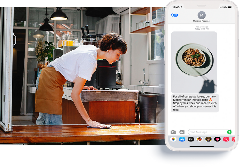 Employee wiping down table and phone showing mms picture messages